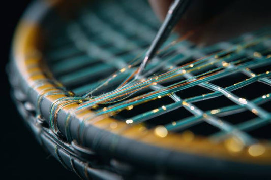 Professional racquet restringing service in Winnipeg showing a tennis racquet being tensioned.